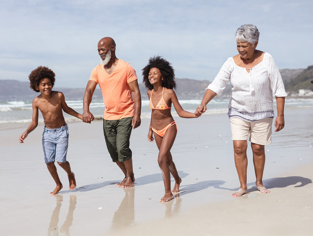 grandparents running with their grandchildren on the beach annuity basics bakersfield ca